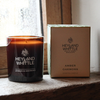 Amber oakmoss glass candle on windowsill 