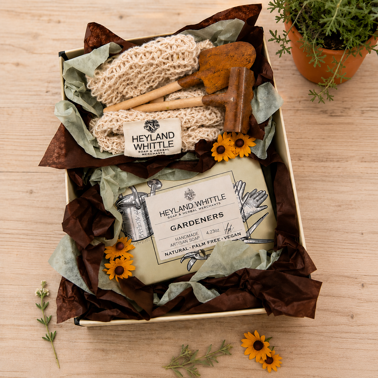 Gift set from Heyland Whittle on a wooden surface with decorative elements.